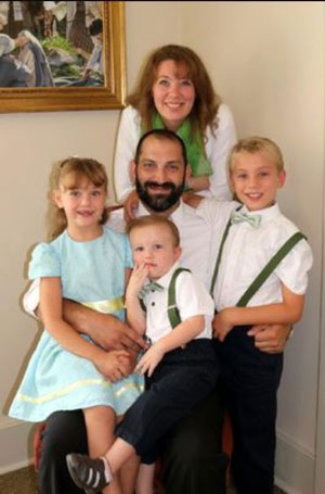 Chiropractor Peter Thompson with his family in family photo